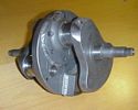 Norton crank with counterweights and sludge trap plugs